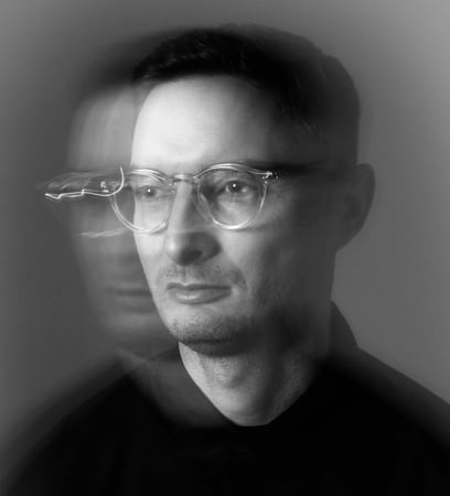 Portrait of Philip Readman, black and white, with a motion-blurred double exposure